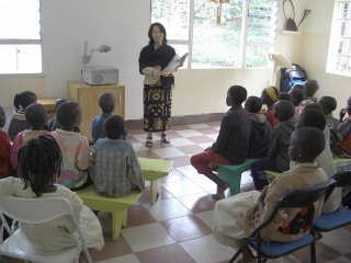 Sarah read a book to children on Sunday school.